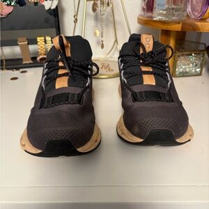 On Running Black and Tan Athletic Shoes